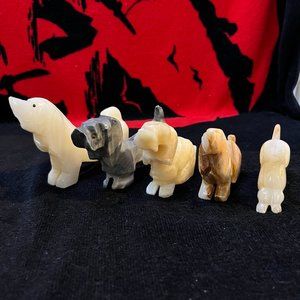 Set Of Five Carved Marble Dogs.